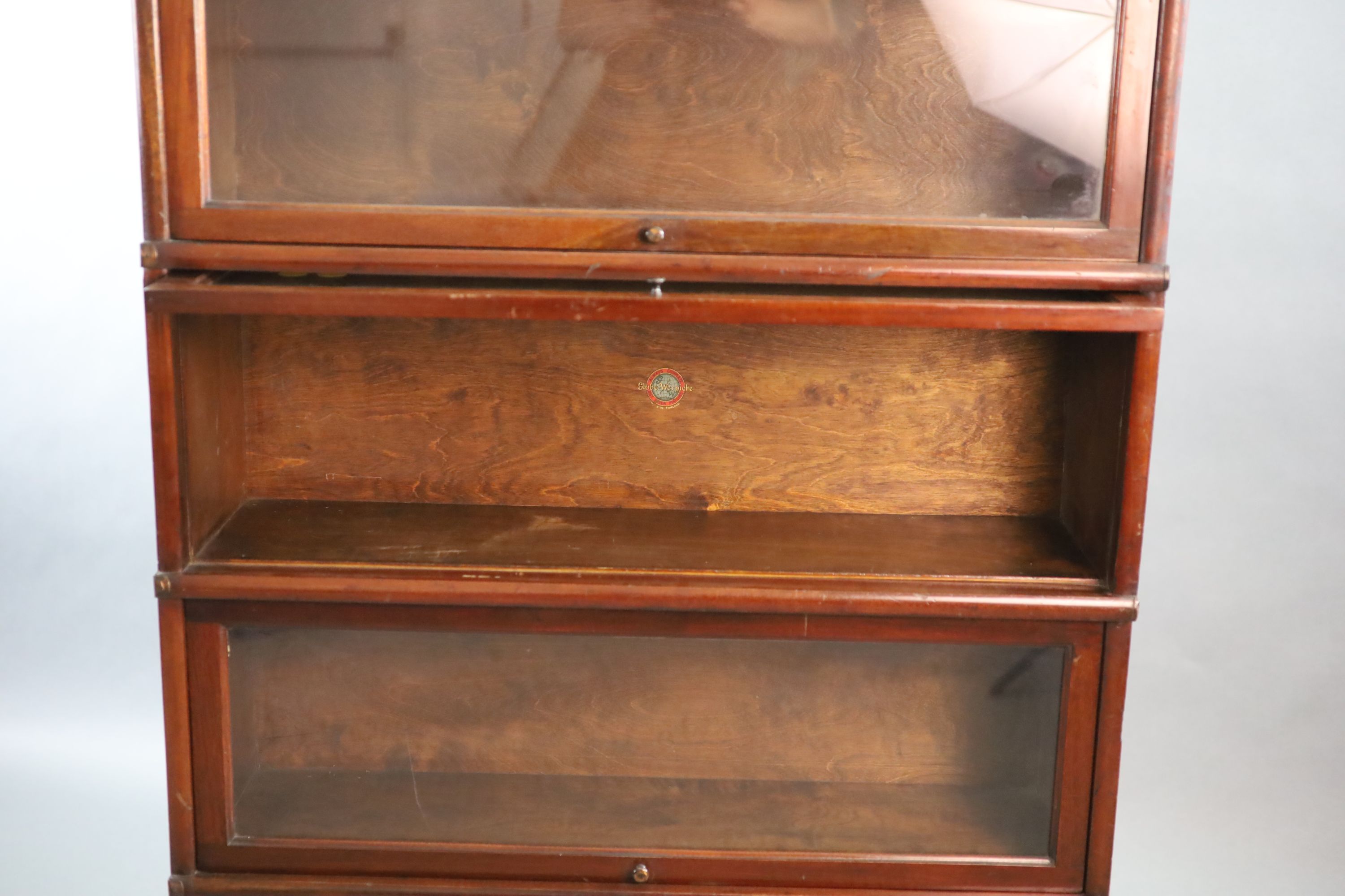 A Globe Wernicke mahogany four section bookcase, W.86.5cm D.27cm H.143cm